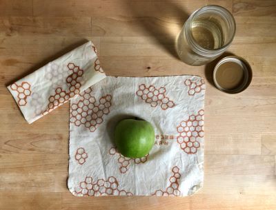 An apple wrapped in reusable beeswax wraps